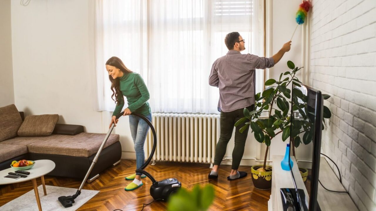 A couple cleaning their home